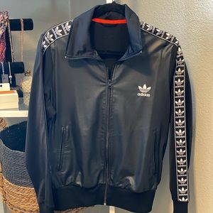Adidas jacket in size Large, fits like a medium